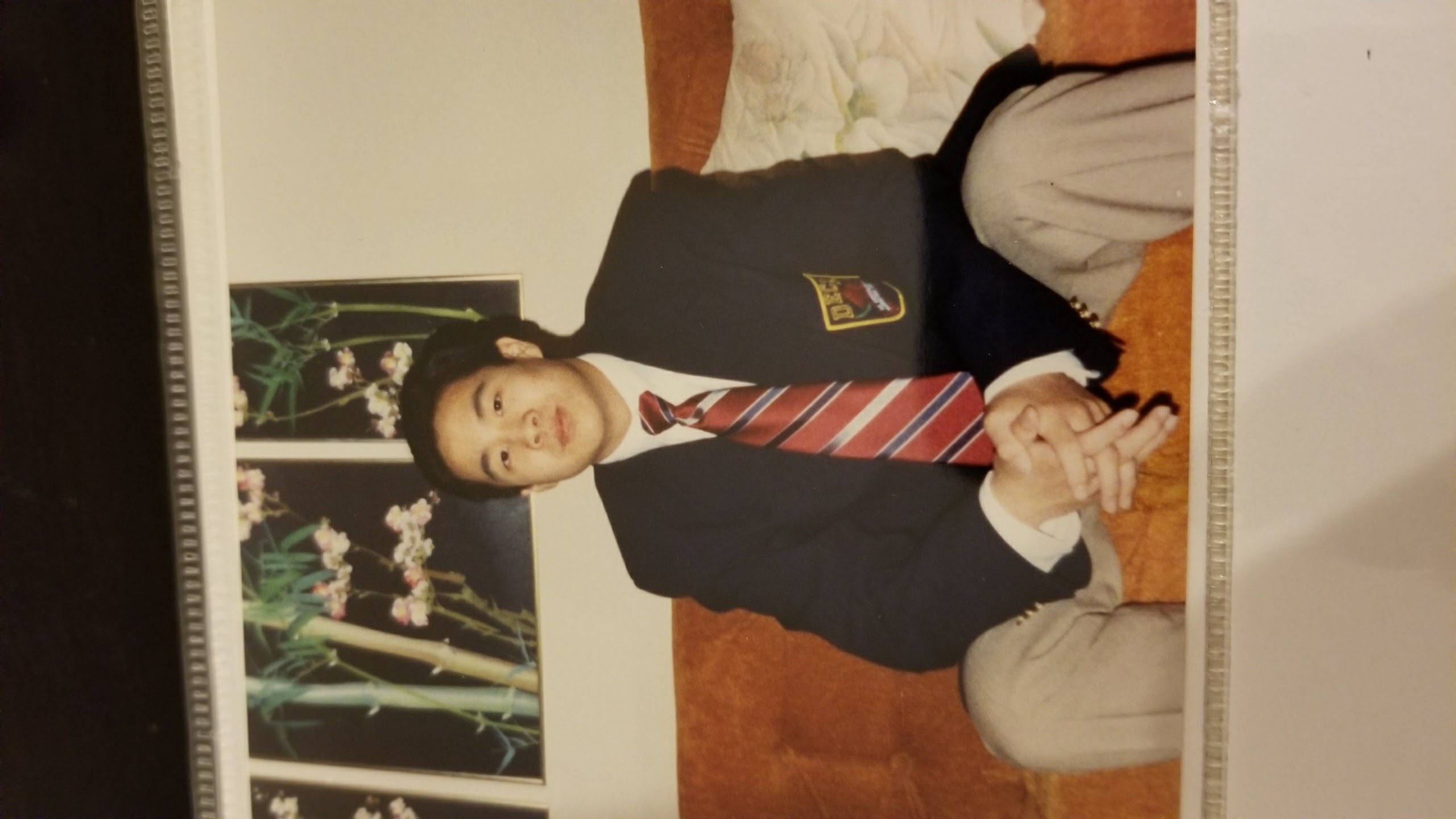 Tejune Kang in his DECA blazer in high school