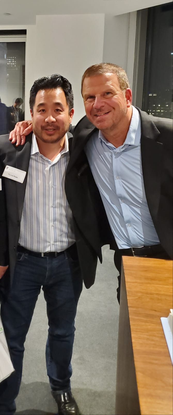 Tejune Kang with Tilman Fertitta at a Harvard Business School event in New York